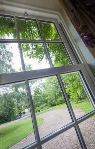 Vertical sliding window from inside with driveway
